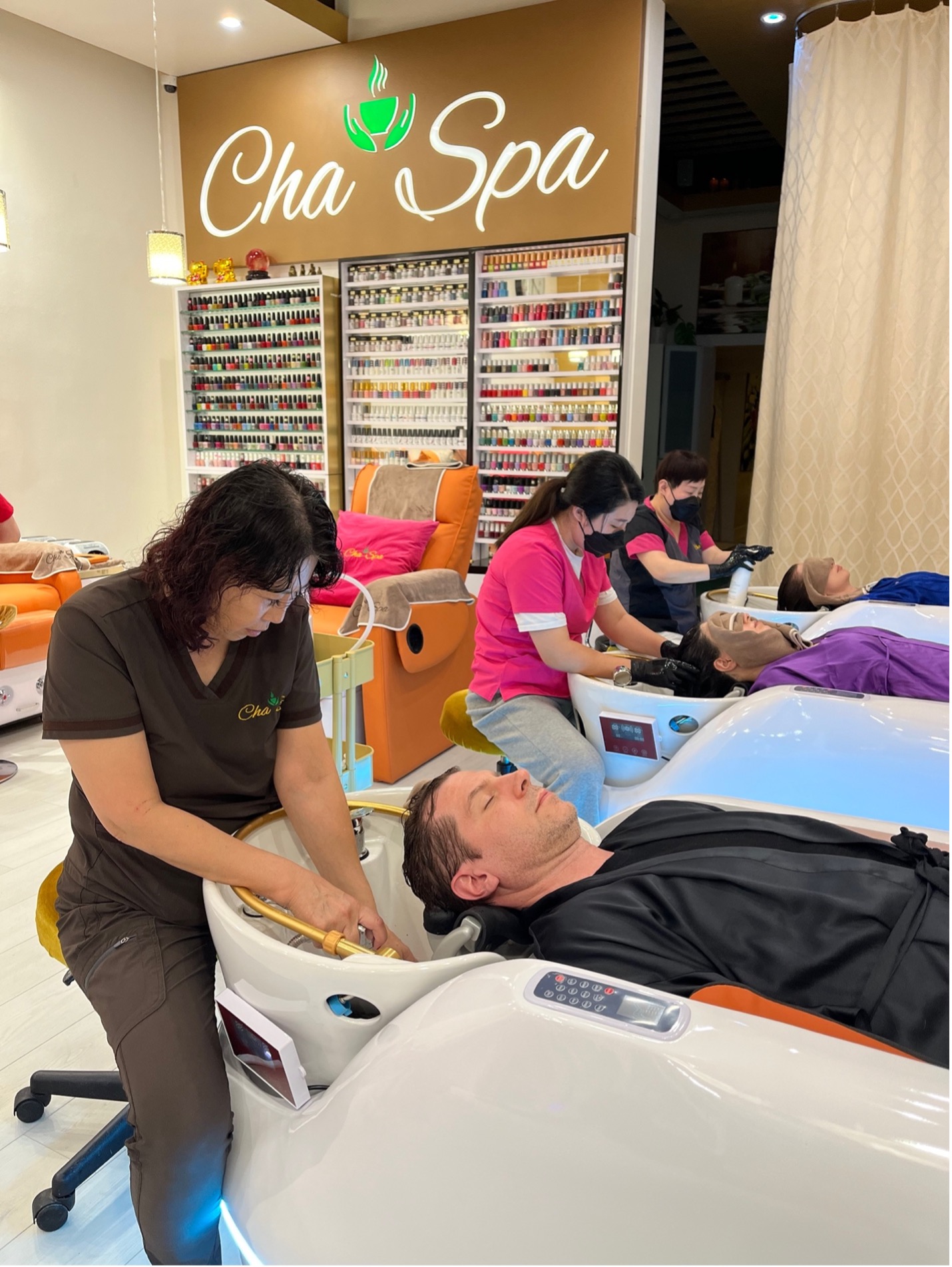 Customers receiving scalp massage